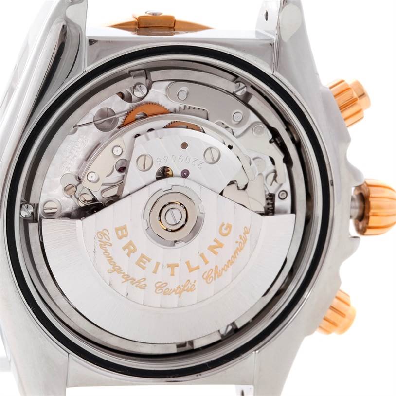 This image shows the back view of a Breitling Chronomat C13356 Men
s Steel and Gold (two tone) White Dial C13356 Men
s Steel and Gold (two tone) White Dial watch, revealing its internal mechanics and rotor.