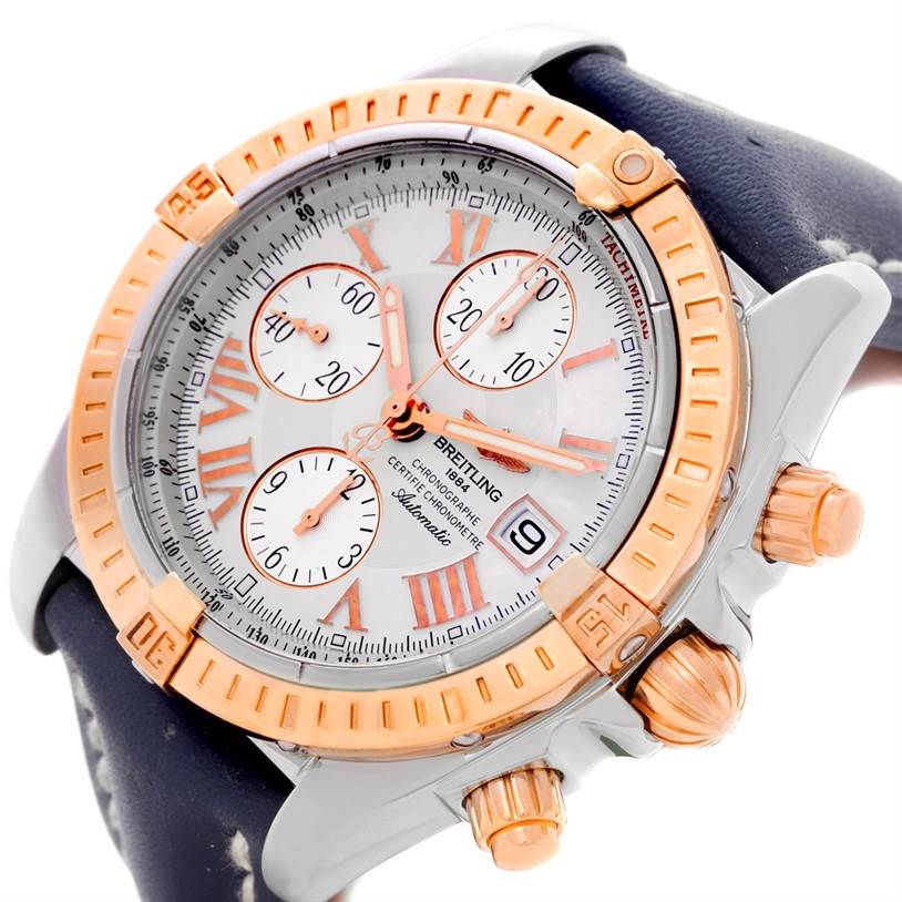 This image shows a close-up of the Breitling Chronomat C13356 Men
s Steel and Gold (two tone) White Dial C13356 Men
s Steel and Gold (two tone) White Dial watch, highlighting the dial, bezel, and pushers on the right side.