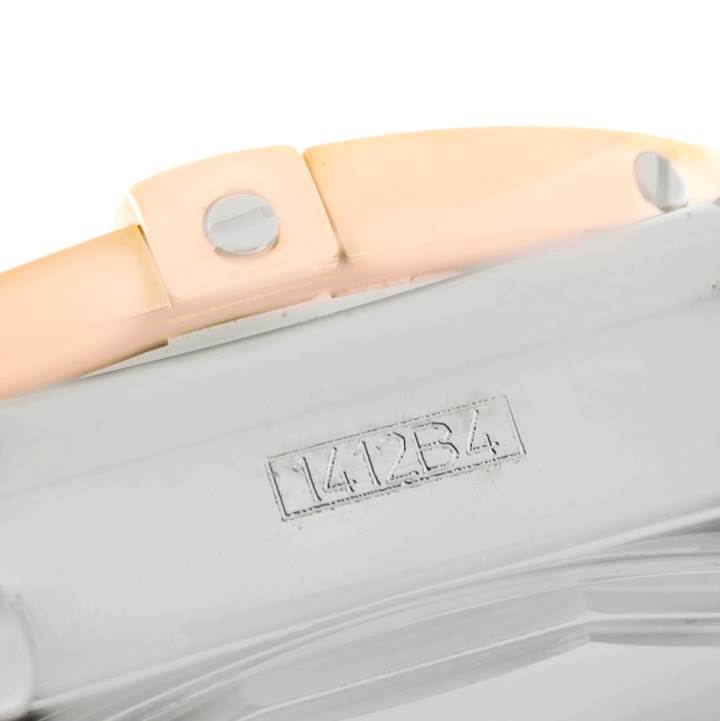 This image shows a close-up of the serial number and a part of the strap and case of the Breitling Chronomat CB0140 Men's Steel and Gold (two tone) White Dial CB0140 Men's Steel and Gold (two tone) White Dial watch.