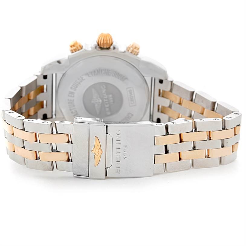 The image shows the back and clasp of a Breitling Chronomat CB0140 Men's Steel and Gold (two tone) White Dial CB0140 Men's Steel and Gold (two tone) White Dial watch, highlighting its stainless steel and gold bracelet.