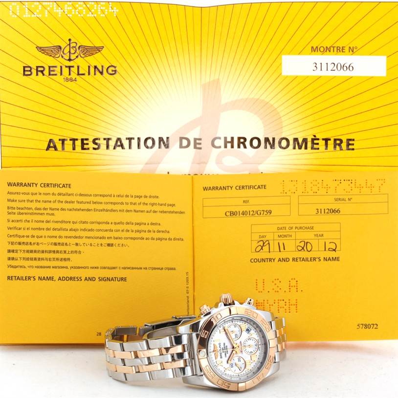 The image shows a Breitling Chronomat CB0140 Men's Steel and Gold (two tone) White Dial CB0140 Men's Steel and Gold (two tone) White Dial watch lying flat with an open warranty certificate document behind it.