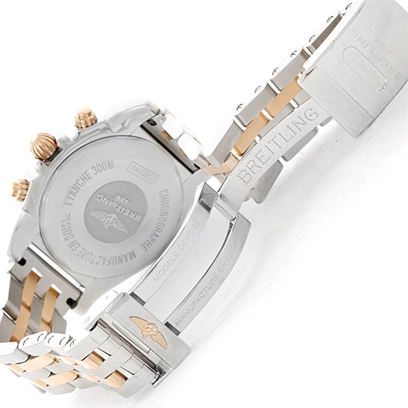 This image shows the back case and bracelet clasp of a Breitling Chronomat CB0140 Men's Steel and Gold (two tone) White Dial CB0140 Men's Steel and Gold (two tone) White Dial watch, highlighting the Swiss engraving and safety catch.