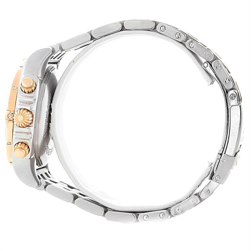 The image shows the side view of a Breitling Chronomat CB0140 Men's Steel and Gold (two tone) White Dial CB0140 Men's Steel and Gold (two tone) White Dial watch, highlighting its band, crown, pushers, and case.