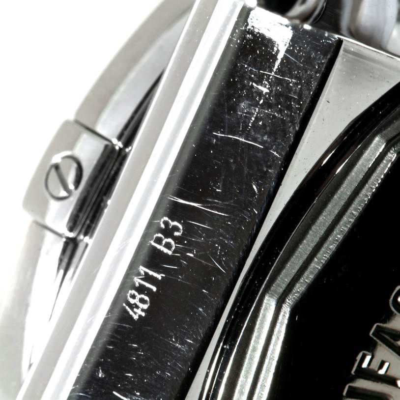 This close-up image shows the side and part of the bezel of a Breitling Chronomat AB0410 Men's Stainless Steel Silver Dial AB0410 Men's Stainless Steel Silver Dial watch, highlighting the model number and markings.