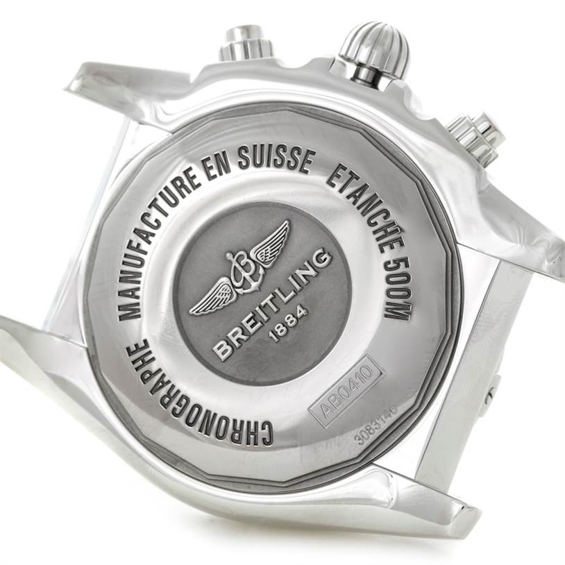 The image shows the back case of a Breitling Chronomat AB0410 Men's Stainless Steel Silver Dial AB0410 Men's Stainless Steel Silver Dial watch with some parts of the lugs and pushers visible.
