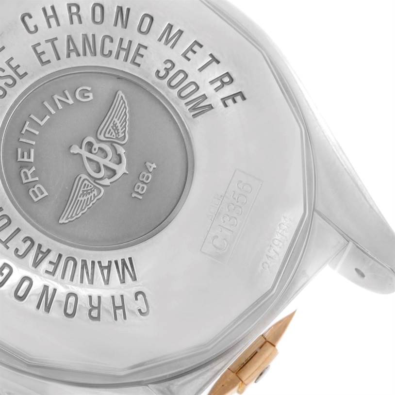 This image shows the backside of a Breitling Chronomat C13356 Men's Steel and Gold (two tone) White Dial C13356 Men's Steel and Gold (two tone) White Dial model, highlighting the casing and branding engravings.
