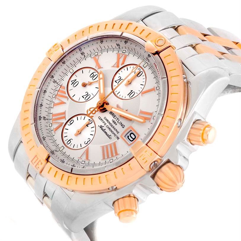 The Breitling Chronomat C13356 Men's Steel and Gold (two tone) White Dial C13356 Men's Steel and Gold (two tone) White Dial watch is shown in a close-up at an oblique angle, highlighting its face, bezel, crown, and two pushers.