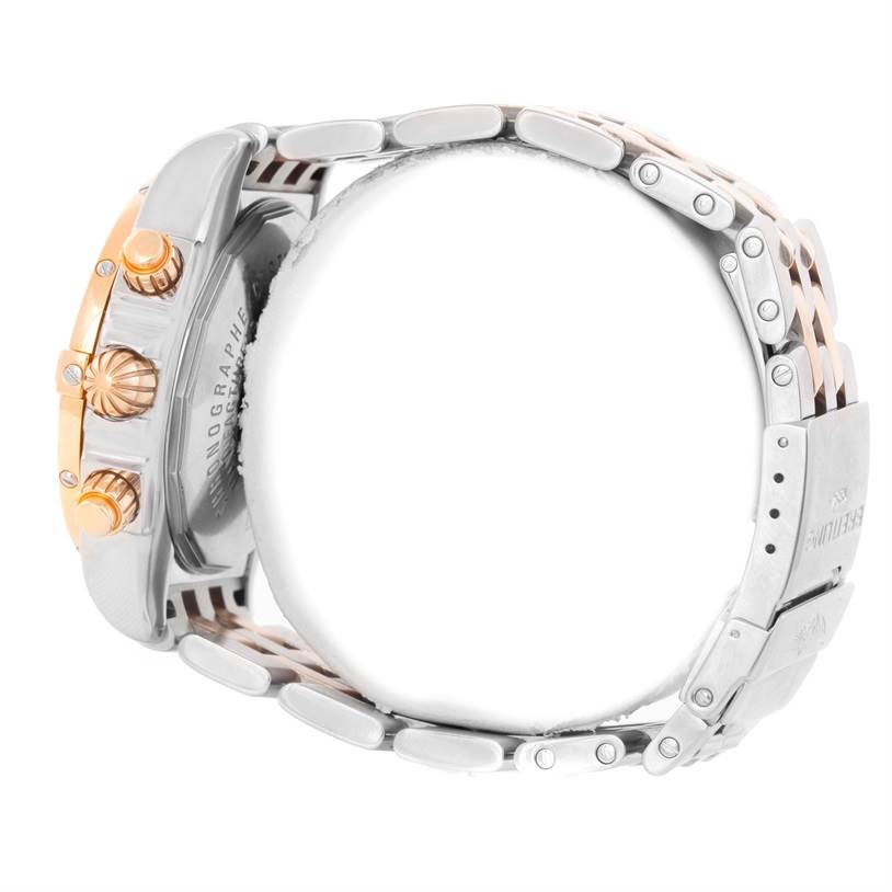 The image shows a side view of the Breitling Chronomat C13356 Men's Steel and Gold (two tone) White Dial C13356 Men's Steel and Gold (two tone) White Dial watch, highlighting the crown, pushers, and part of the bracelet.
