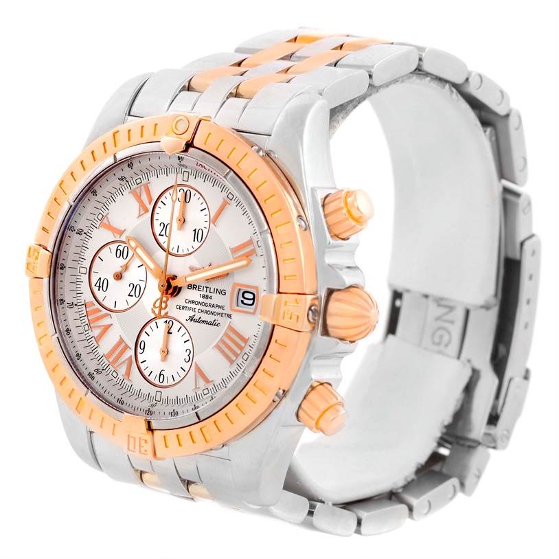 The image shows a side-angled view of the Breitling Chronomat C13356 Men's Steel and Gold (two tone) White Dial C13356 Men's Steel and Gold (two tone) White Dial watch, highlighting the face, chronograph subdials, and part of the metal bracelet.