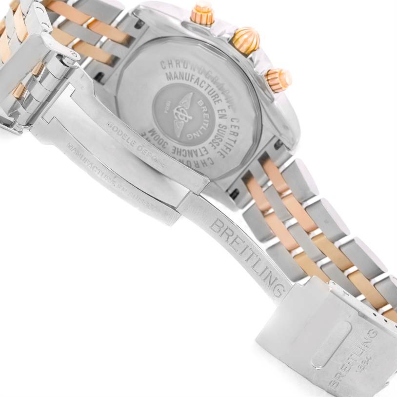 The image shows the back case and clasp of a Breitling Chronomat C13356 Men's Steel and Gold (two tone) White Dial C13356 Men's Steel and Gold (two tone) White Dial watch, highlighting the metal bracelet and engraved branding.