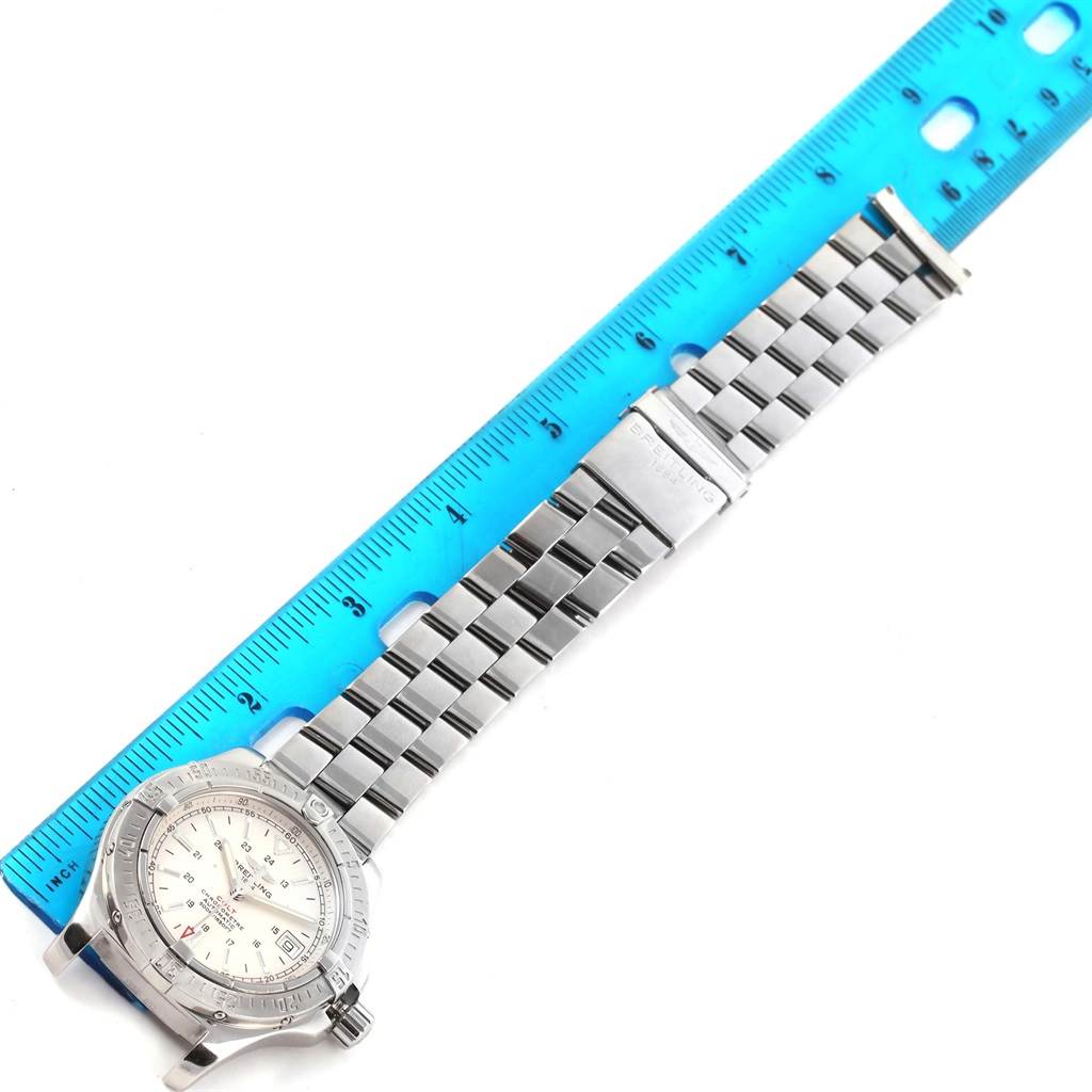 The image shows a Breitling Colt A17380 Men's Stainless Steel Silver Dial A17380 Men's Stainless Steel Silver Dial watch with its bracelet and clasp aligned next to a blue ruler.