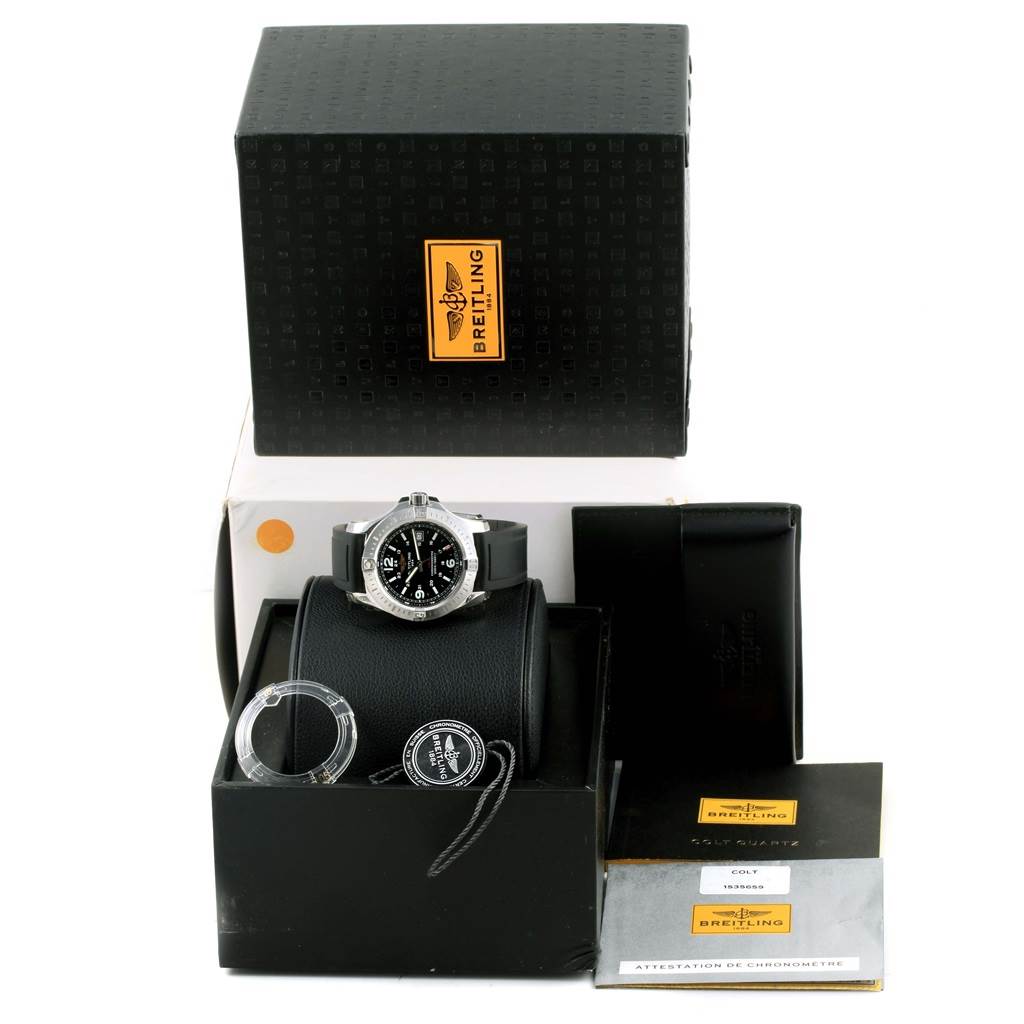 The image shows a Breitling Colt A74388 Men
s Stainless Steel Black Dial A74388 Men
s Stainless Steel Black Dial watch, box, papers, and accessories from a frontal angle.