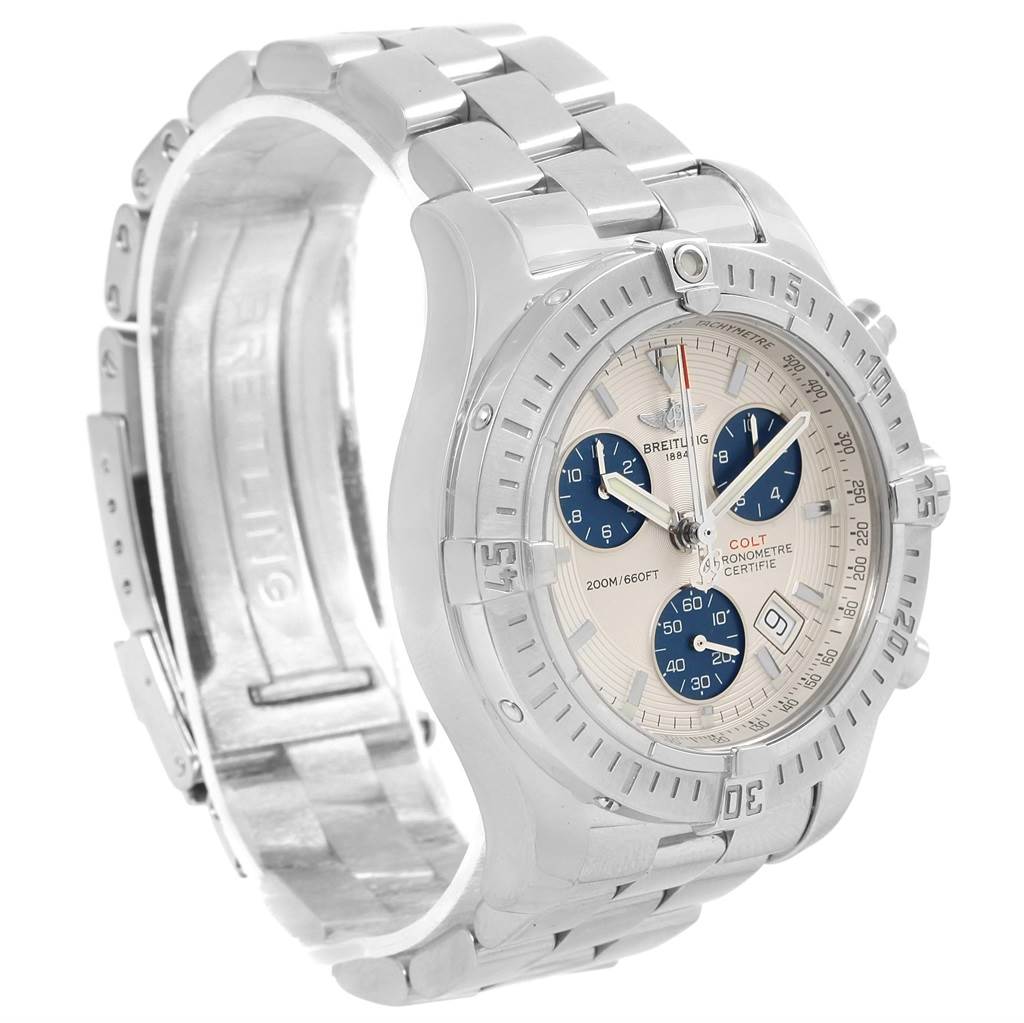 The Breitling Colt A73380 Men
s Stainless Steel White Dial A73380 Men
s Stainless Steel White Dial watch is shown from an angled perspective focusing on the face, case, crown, and partially open stainless steel bracelet.