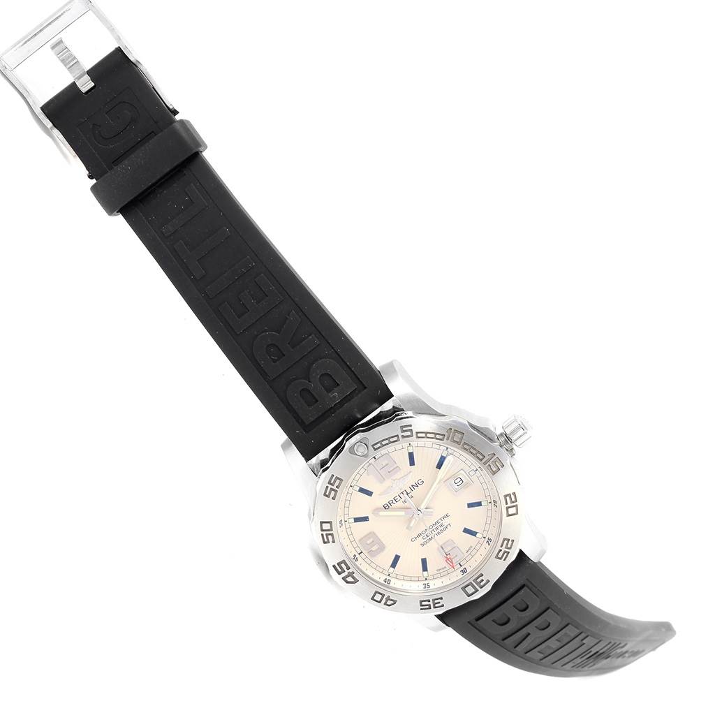 The Breitling Colt A74387 Men's Stainless Steel Silver Dial A74387 Men's Stainless Steel Silver Dial watch is shown at an angle, displaying its face, bezel, crown, and black rubber strap.