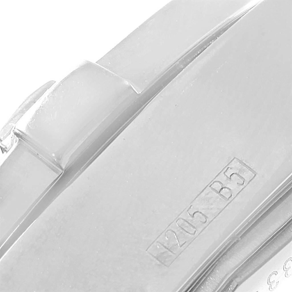 The image shows a close-up of the clasp of a Breitling Colt A17380 Men's Stainless Steel Blue Dial A17380 Men's Stainless Steel Blue Dial watch, featuring its engraved serial number.