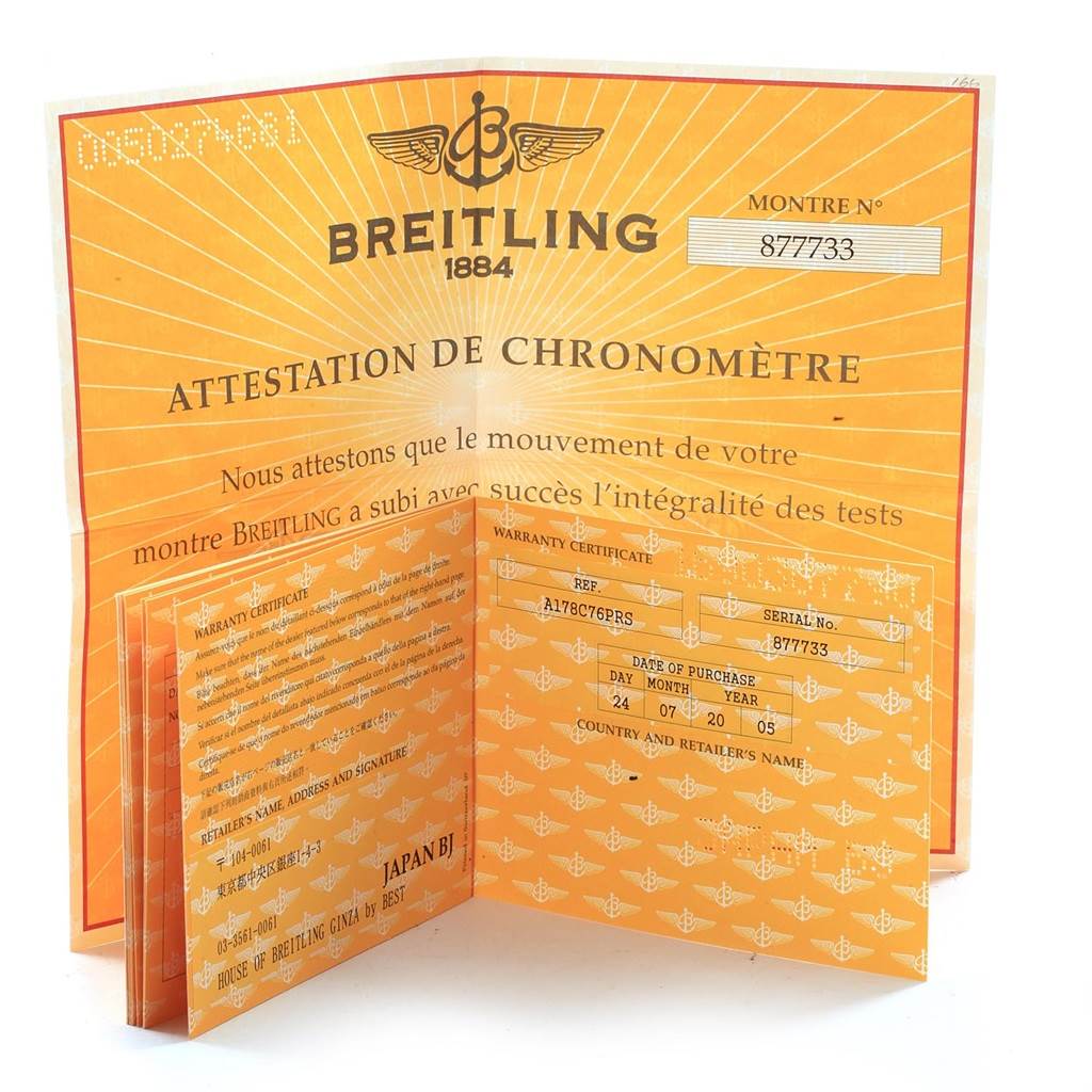The image shows open warranty and chronometer certification booklets for a Breitling Colt A17380 Men's Stainless Steel Blue Dial A17380 Men's Stainless Steel Blue Dial watch.