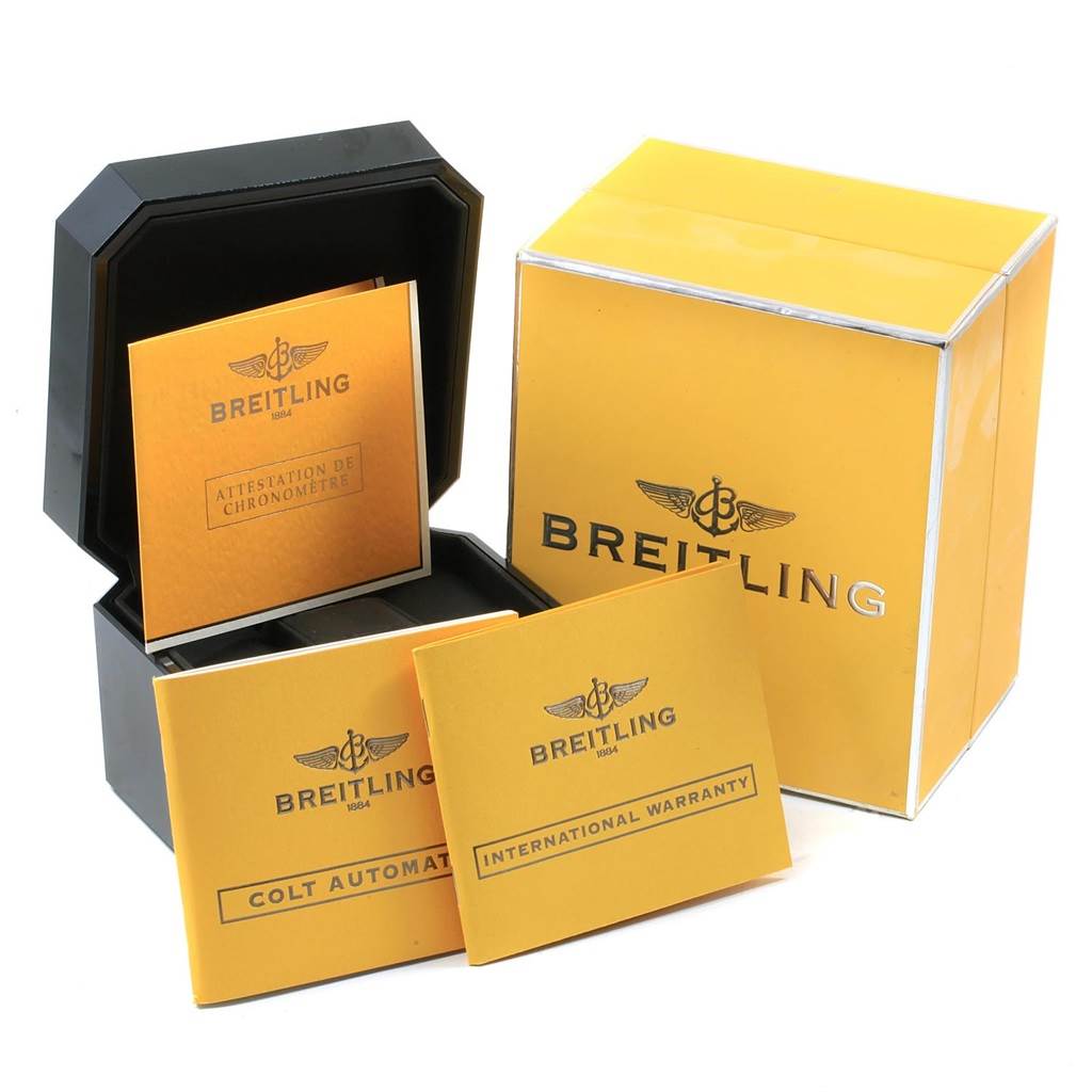 The image shows packaging and documentation for a Breitling Colt A17380 Men's Stainless Steel Black Dial A17380 Men's Stainless Steel Black Dial watch, including its box, manuals, and warranty card.