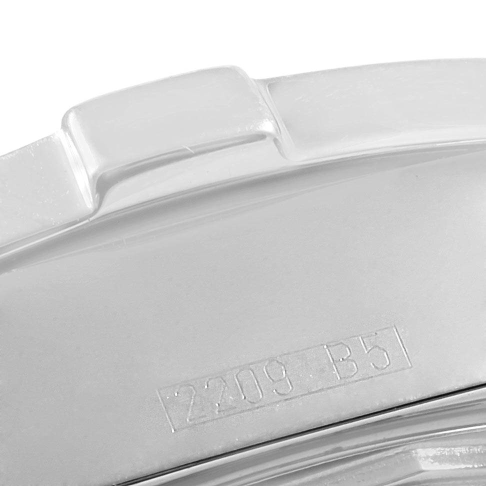 The image shows a close-up of the bezel and part of the case back of a Breitling Colt A17380 Men's Stainless Steel Blue Dial A17380 Men's Stainless Steel Blue Dial watch with an engraved number "2209 B5."