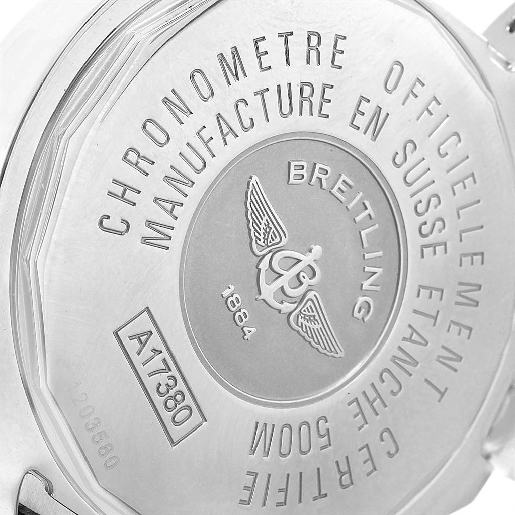 The image shows the back case of the Colt model by Breitling, highlighting its engravings and serial number.