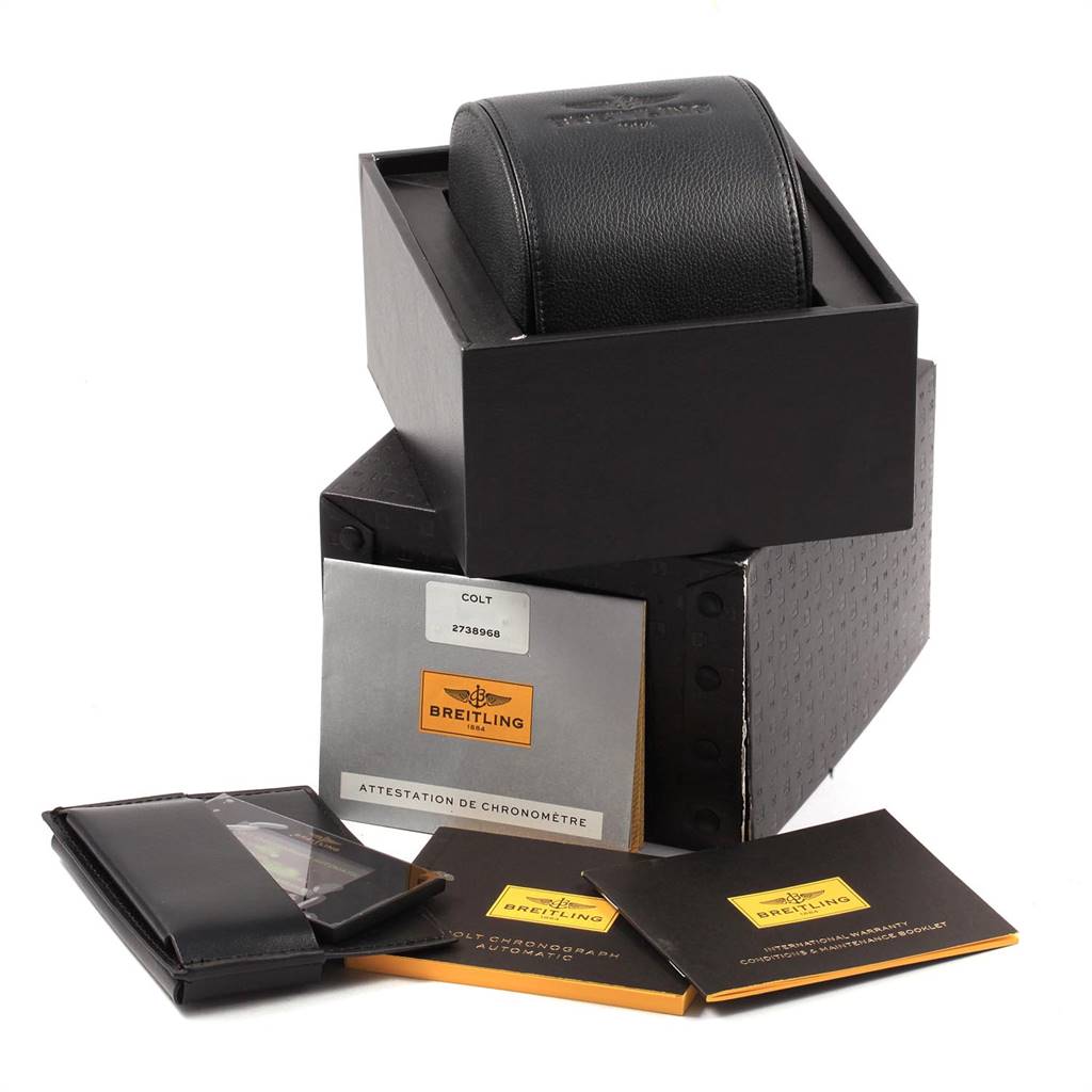 The image shows the packaging and documentation for a Breitling Colt A13388 Men's Stainless Steel Black Dial A13388 Men's Stainless Steel Black Dial watch, including the box, case, and booklets.