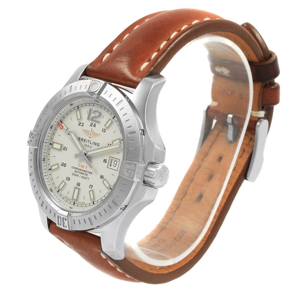 This is a side view of the Breitling Colt A17313 Men's Stainless Steel Silver Dial A17313 Men's Stainless Steel Silver Dial watch, showing the face, bezel, crown, and leather strap.