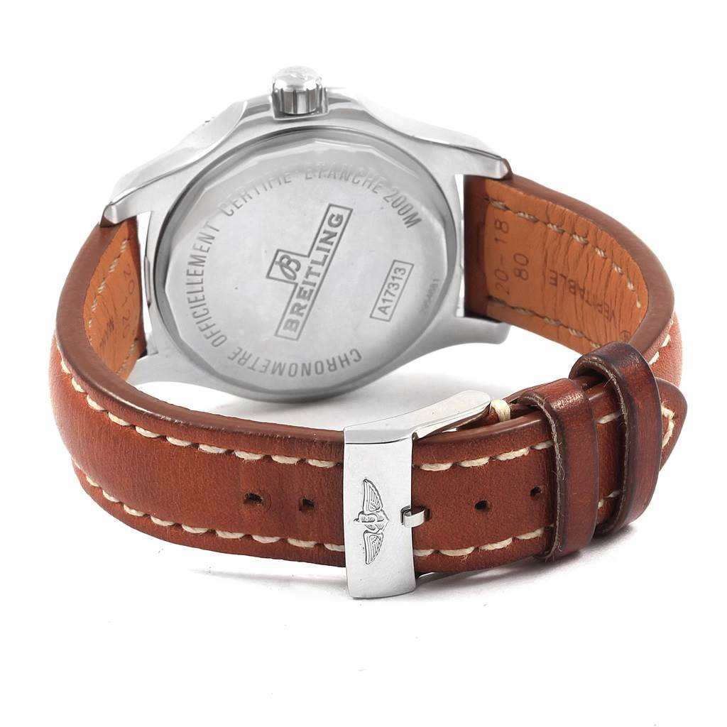 The image shows the back case and leather strap of a Breitling Colt A17313 Men's Stainless Steel Silver Dial A17313 Men's Stainless Steel Silver Dial model watch, focusing on the engraved back and clasp.