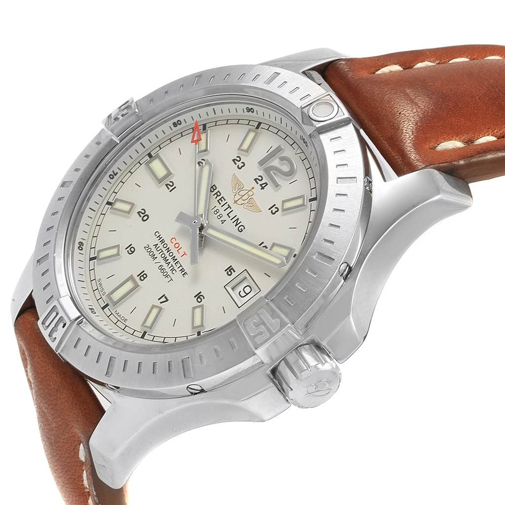 The image shows a side angle view of the Breitling Colt A17313 Men's Stainless Steel Silver Dial A17313 Men's Stainless Steel Silver Dial watch, highlighting its face, bezel, and leather strap.