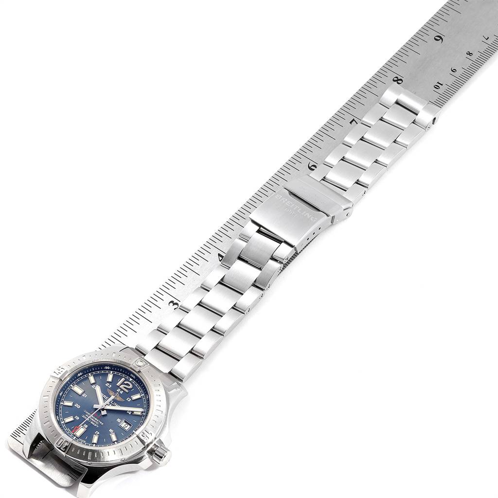 The image shows a top view of a Breitling Colt A17388 Men's Stainless Steel Blue Dial A17388 Men's Stainless Steel Blue Dial watch, including the face, bracelet, and clasp measured against a ruler.