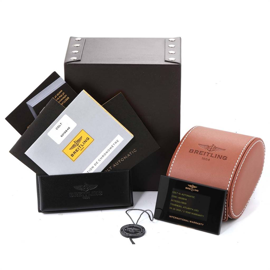 The image shows the Breitling Colt A17313 Men's Stainless Steel White Dial A17313 Men's Stainless Steel White Dial watch packaging, manuals, warranty card, and a leather case.