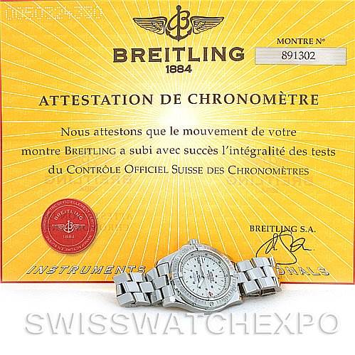 The image displays a Breitling Colt A17380 Men's Stainless Steel Silver Dial A17380 Men's Stainless Steel Silver Dial watch placed flat on its bracelet, with its certificate of chronometer attestation behind it.
