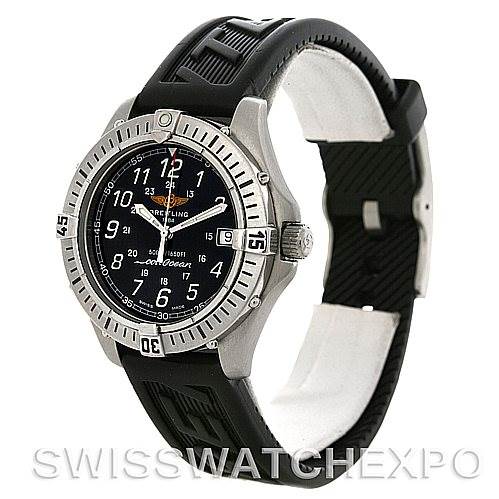 The image shows a Colt model watch by Breitling from a front side angle, displaying the bezel, dial, and black strap.