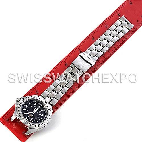 The Breitling Colt A64350 Men
s Stainless Steel Black Dial A64350 Men
s Stainless Steel Black Dial watch is shown from an overhead view, placed next to a red ruler for size reference.