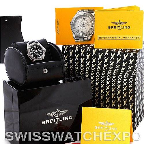 The image shows a Breitling Colt A32350 Men's Stainless Steel Grey Dial A32350 Men's Stainless Steel Grey Dial watch on a stand, with its box, manual, warranty card, and additional packaging accessories.