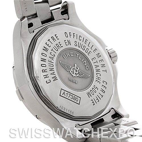 The image shows the back case of a Breitling Colt A17380 Stainless Steel Silver Dial A17380 Stainless Steel Silver Dial watch, highlighting its engravings and attached metal bracelet.