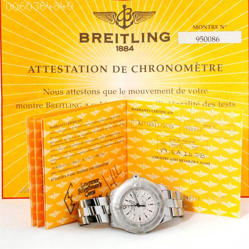 The image shows a Breitling Colt A17380 Men
s Stainless Steel Silver Dial A17380 Men
s Stainless Steel Silver Dial watch and warranty certificate, with both items displayed from the front.