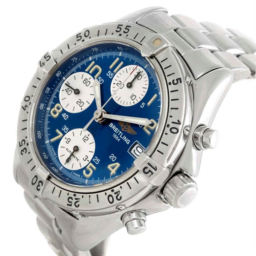 The image shows a close-up, three-quarter view of a Breitling Colt A13035 Men's Stainless Steel Blue Dial A13035 Men's Stainless Steel Blue Dial watch, displaying its blue dial, bezel, chronograph subdials, and metal bracelet.