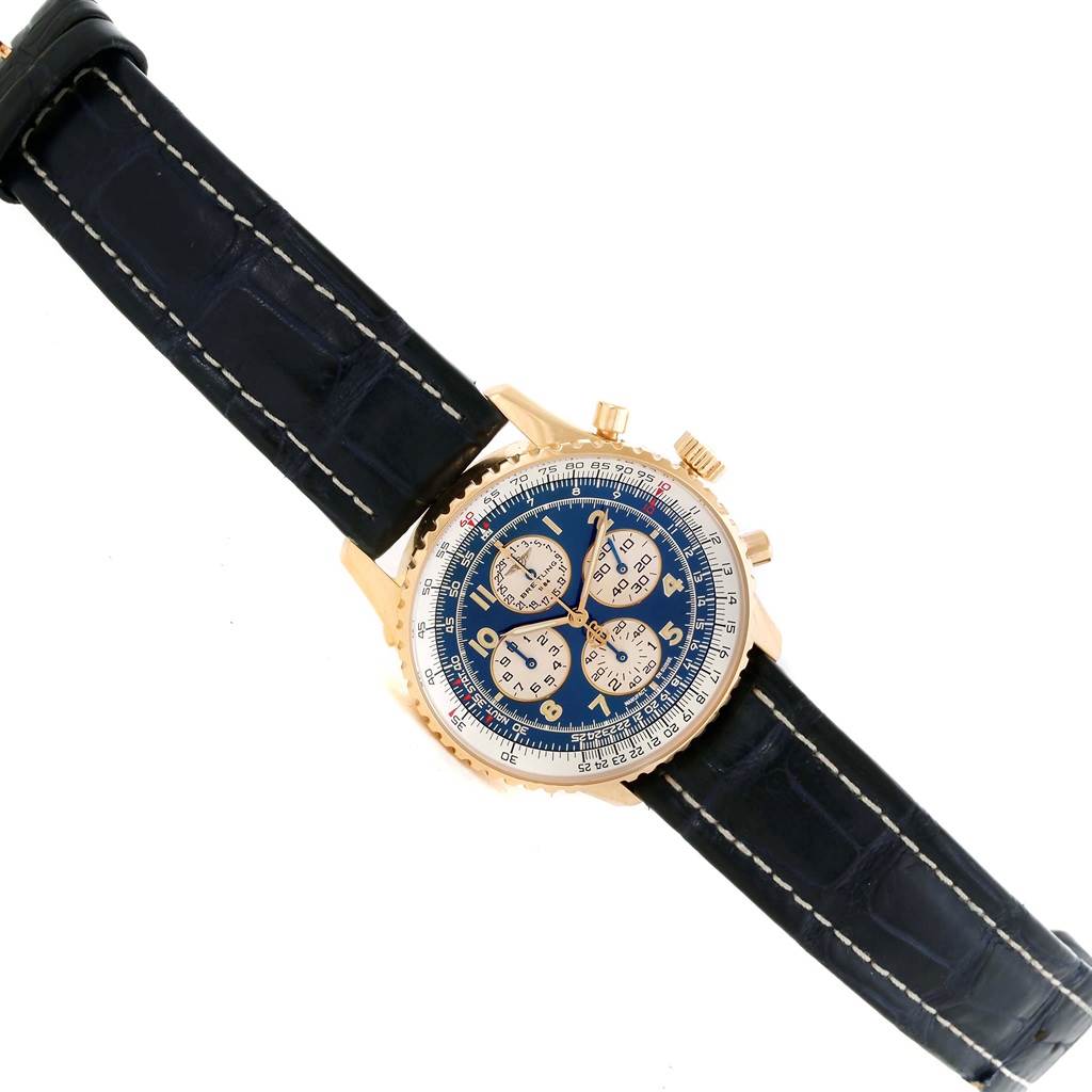 The Breitling Navitimer K33030 Men
s Yellow Gold Blue Dial K33030 Men
s Yellow Gold Blue Dial watch is shown at a slight angle from the front, displaying the case, dial, crown, pushers, and strap.