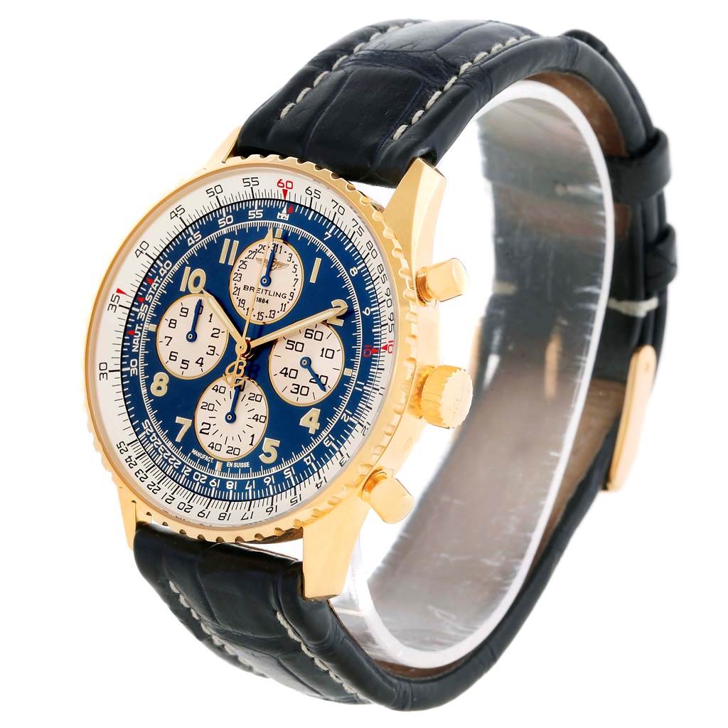 The image shows a Breitling Navitimer K33030 Men
s Yellow Gold Blue Dial K33030 Men
s Yellow Gold Blue Dial watch at a three-quarter angle, highlighting its gold case, blue dial, chronograph subdials, and black leather strap.