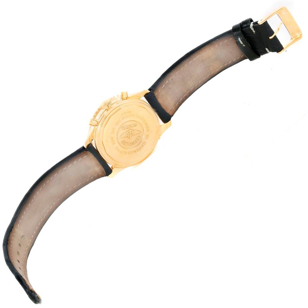 This image shows the backside and strap of a Breitling Navitimer K33030 Men
s Yellow Gold Blue Dial K33030 Men
s Yellow Gold Blue Dial watch with a gold case and black leather strap.