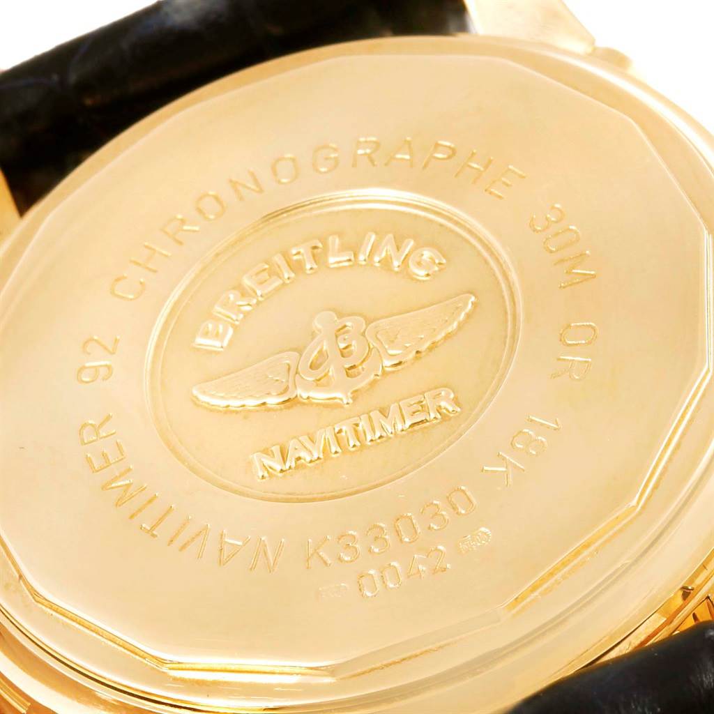 The image shows the back case of a Breitling Navitimer K33030 Men
s Yellow Gold Blue Dial K33030 Men
s Yellow Gold Blue Dial watch, highlighting the inscription and branding.