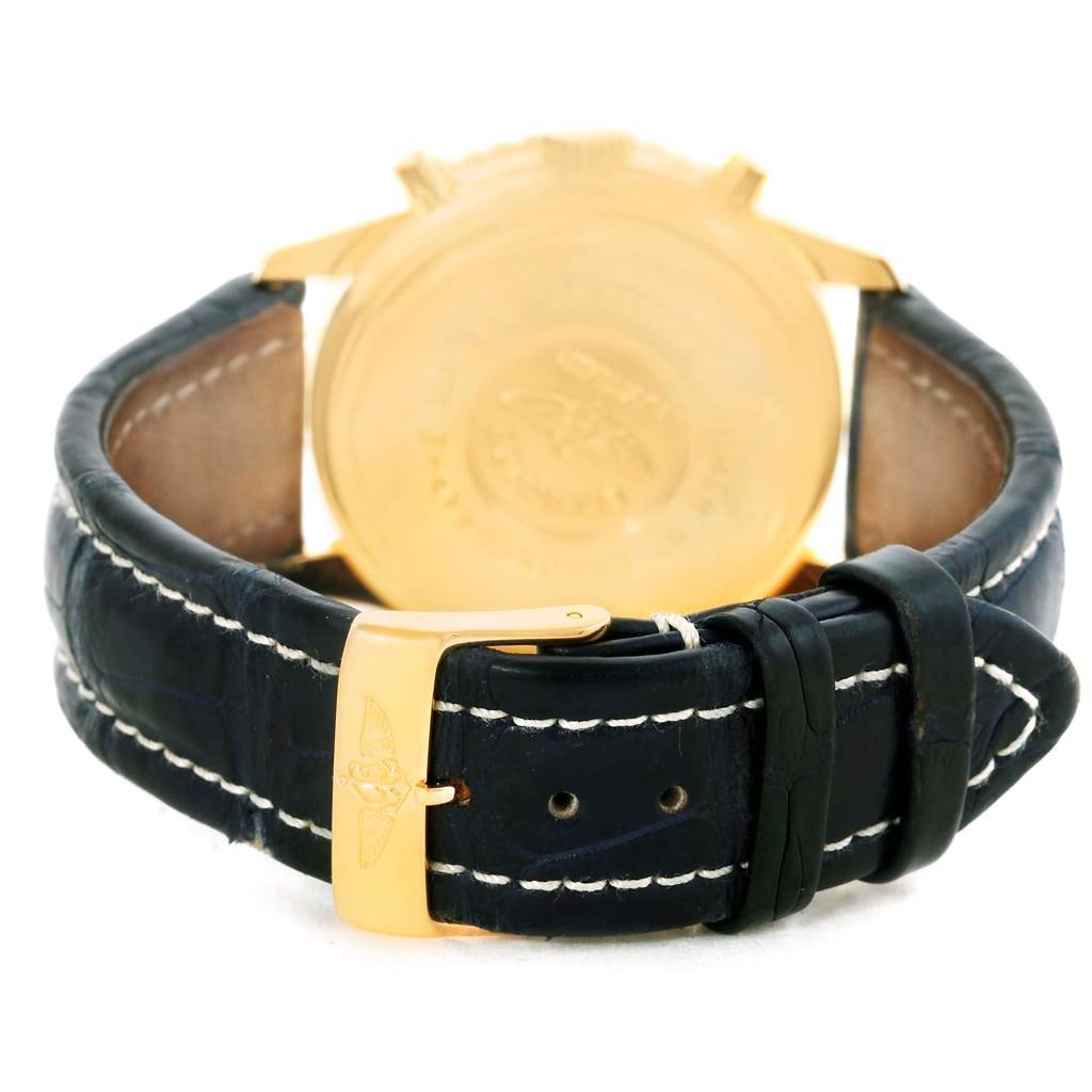 This image shows the back view of a Breitling Navitimer K33030 Men
s Yellow Gold Blue Dial K33030 Men
s Yellow Gold Blue Dial watch, highlighting the leather strap and gold buckle.