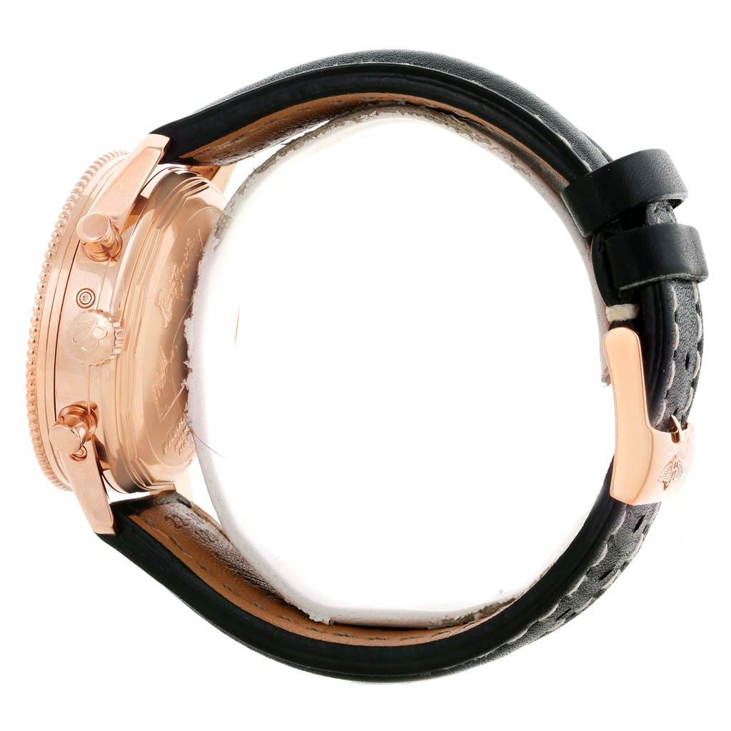 The image shows a side view of a Breitling Navitimer R19350 Men's Rose Gold Black Dial R19350 Men's Rose Gold Black Dial watch, highlighting the case, crowns, and part of the leather strap.