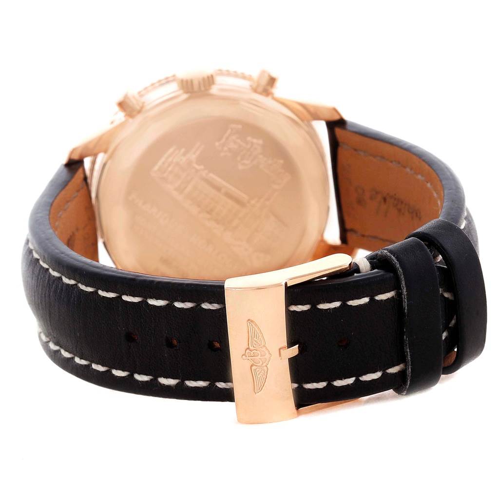The image shows the back side and clasp of a Breitling Navitimer R19350 Men's Rose Gold Black Dial R19350 Men's Rose Gold Black Dial watch, featuring a black leather strap with white stitching.
