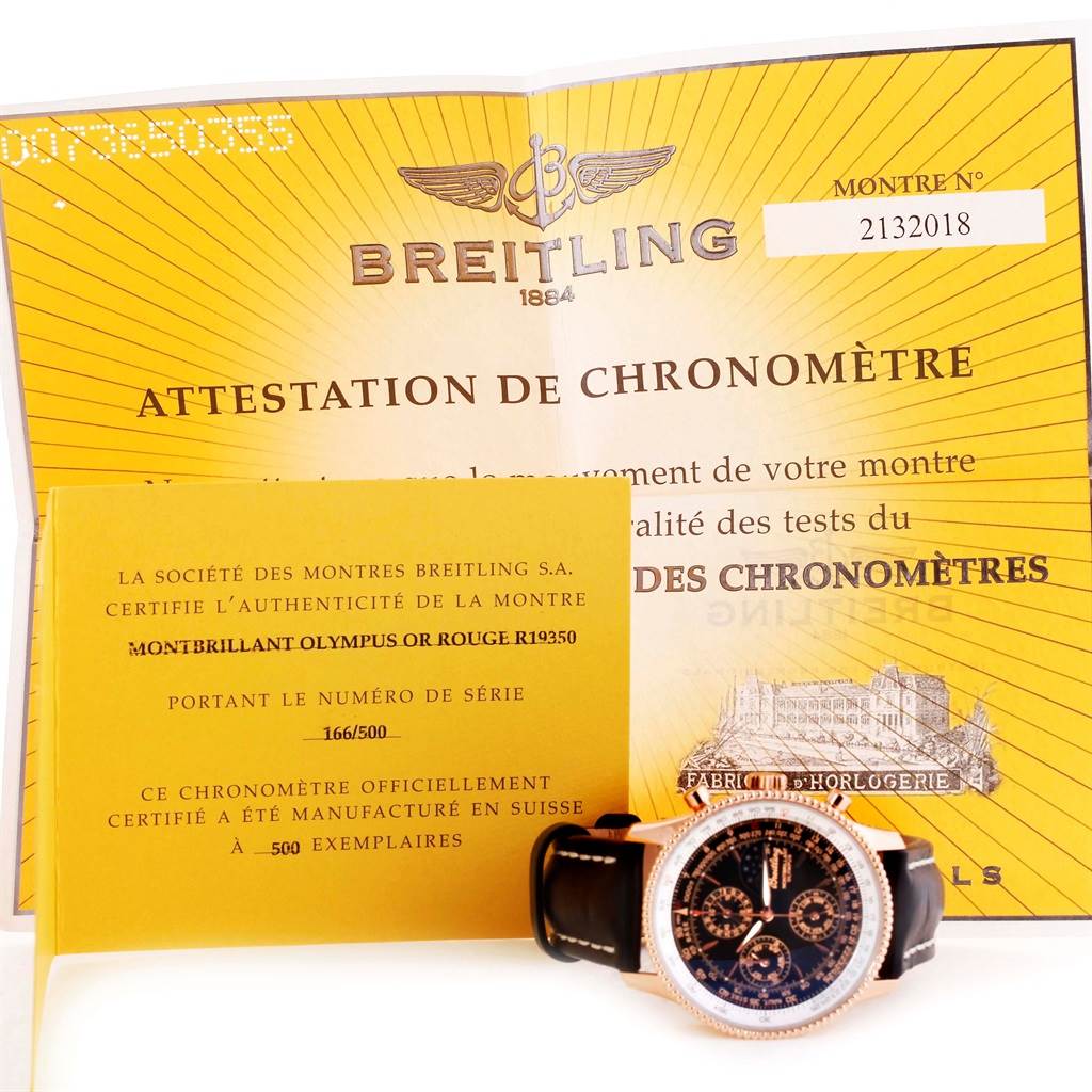 The image shows a Breitling Navitimer R19350 Men's Rose Gold Black Dial R19350 Men's Rose Gold Black Dial watch laid flat with its certificates of authenticity and chronometer.