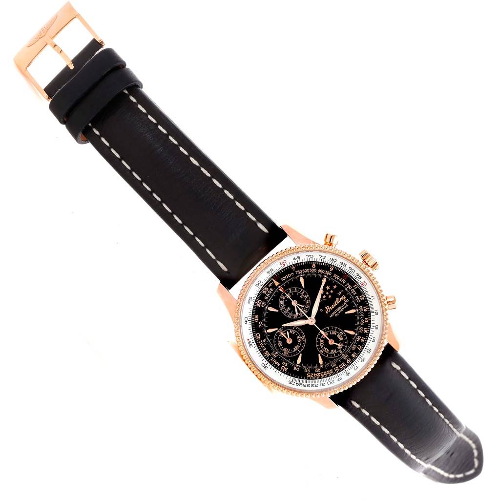 The image shows a top view of a Breitling Navitimer R19350 Men's Rose Gold Black Dial R19350 Men's Rose Gold Black Dial watch with a black leather strap and a black dial.