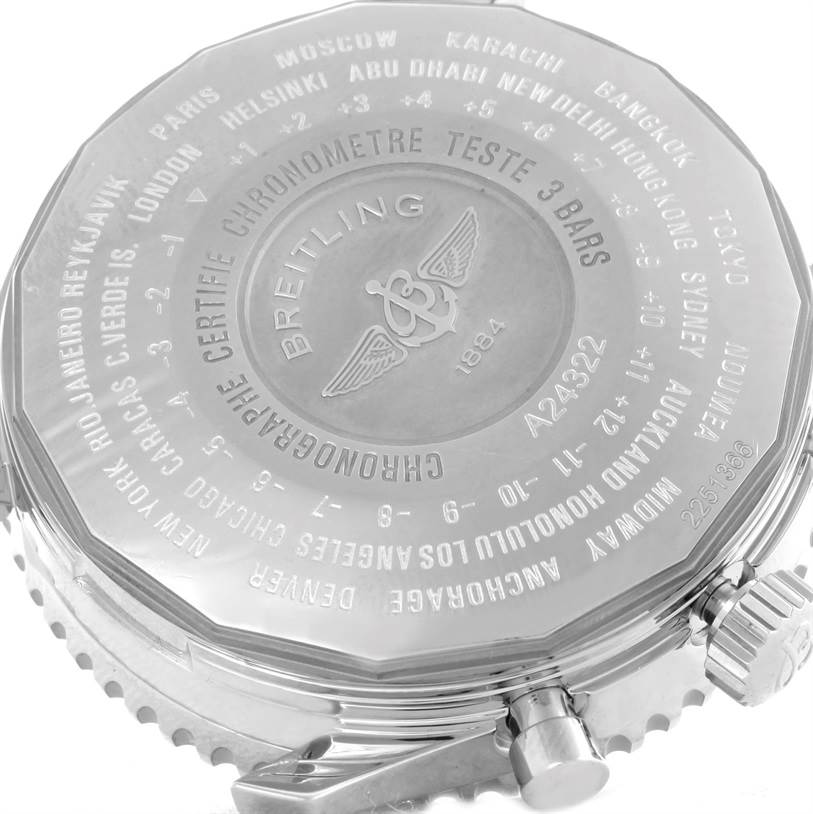 This image shows the back case of a Breitling Navitimer A24322 Men's Stainless Steel Silver Dial A24322 Men's Stainless Steel Silver Dial watch at an angle, highlighting the engraved details and the crown.