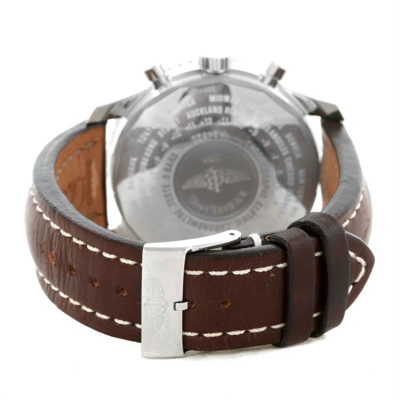 The image shows the back view of the Breitling Navitimer A24322 Men's Stainless Steel Silver Dial A24322 Men's Stainless Steel Silver Dial watch focusing on the brown leather strap and the watch’s engraved case back.