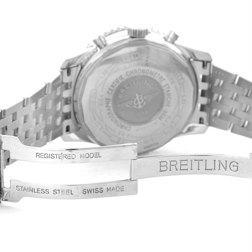 The image shows the backside of a Breitling Navitimer A19340 Men's Stainless Steel Silver Dial A19340 Men's Stainless Steel Silver Dial watch, along with its stainless steel bracelet and clasp.