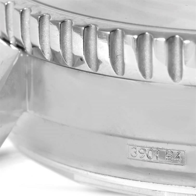 The image shows a close-up angle of the knurled bezel and part of the case of a Breitling Navitimer A19340 Men's Stainless Steel Silver Dial A19340 Men's Stainless Steel Silver Dial watch.