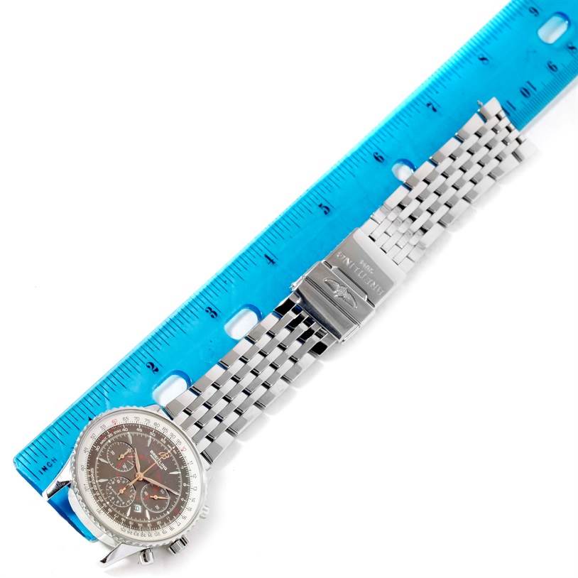 The Breitling Navitimer A41370 Men
s Stainless Steel Brown Dial A41370 Men
s Stainless Steel Brown Dial watch is shown from a top-down angle, with the face, bracelet, and clasp visible, alongside a ruler for scale.